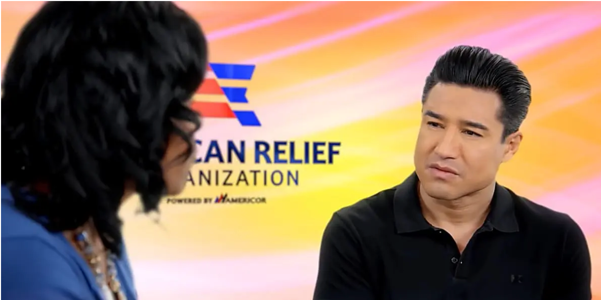 Photo of Lynnette Khalfani-Cox and Mario Lopez talking to each other